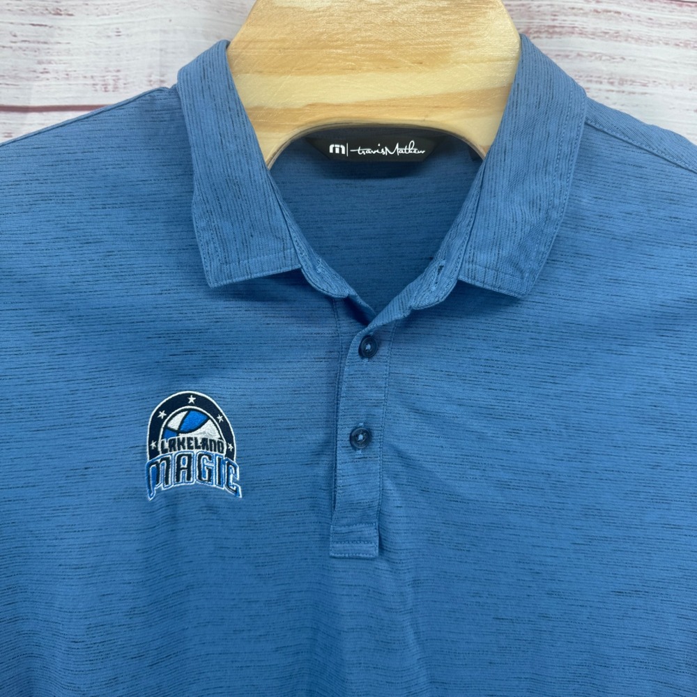 Travis Mathew Mens XL Lakeland‎ Magic Polo Shirt Heather Blue AdventHealth Logo